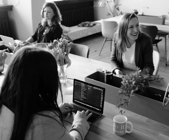 workers at their desk working